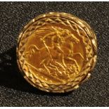 A George V gold half sovereign, 1913, mounted in 9ct gold as a signet ring, 7.9g