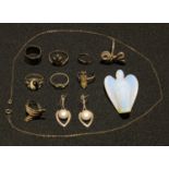 A pair of silver and pearl earrings; a moonstone angel pendant; a sterling silver ring, another;