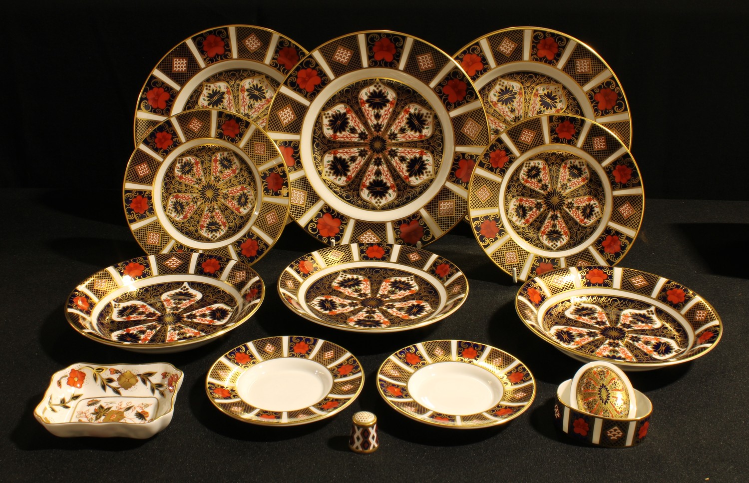 A Royal Crown Derby Imari 1128 pattern side plate, first quality; others 1128 side plates, dishes,