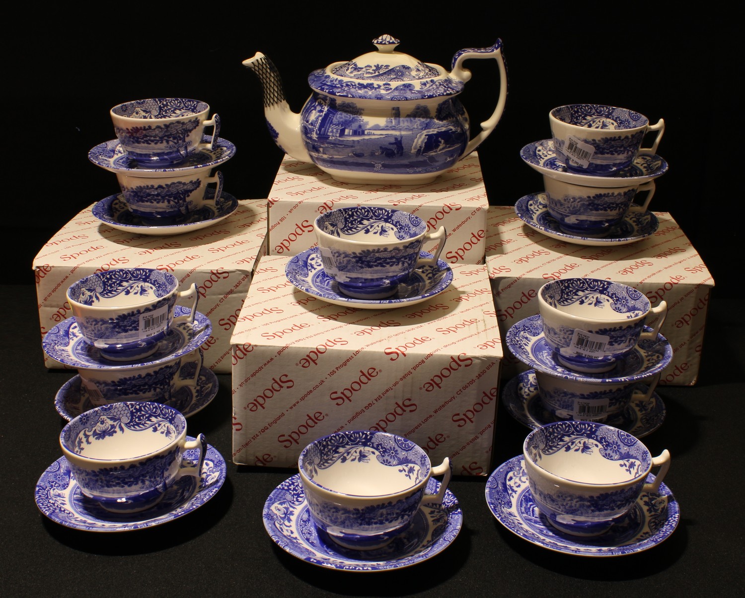 A Spode Italian teapot, boxed; a set of twelve tea cups and saucers, all boxed