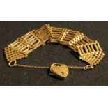 A 9ct gold gate link bracelet, love heart clasp, safety chain, 39.9g