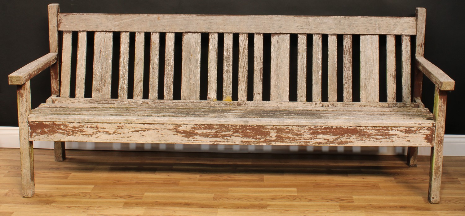 A garden bench, 85.5cm high, 200.5cm wide, the seat 197.5cm wide and 40.5cm deep