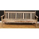 A garden bench, 85.5cm high, 200.5cm wide, the seat 197.5cm wide and 40.5cm deep