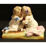 A German porcelain KPM figure group, Playing Baby, 15cm wide, number 309/21, printed mark in blue