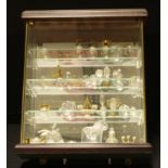 A miniature glazed wall hanging display cabinet, 28.5cm x 25cm, a collection of assorted crystal