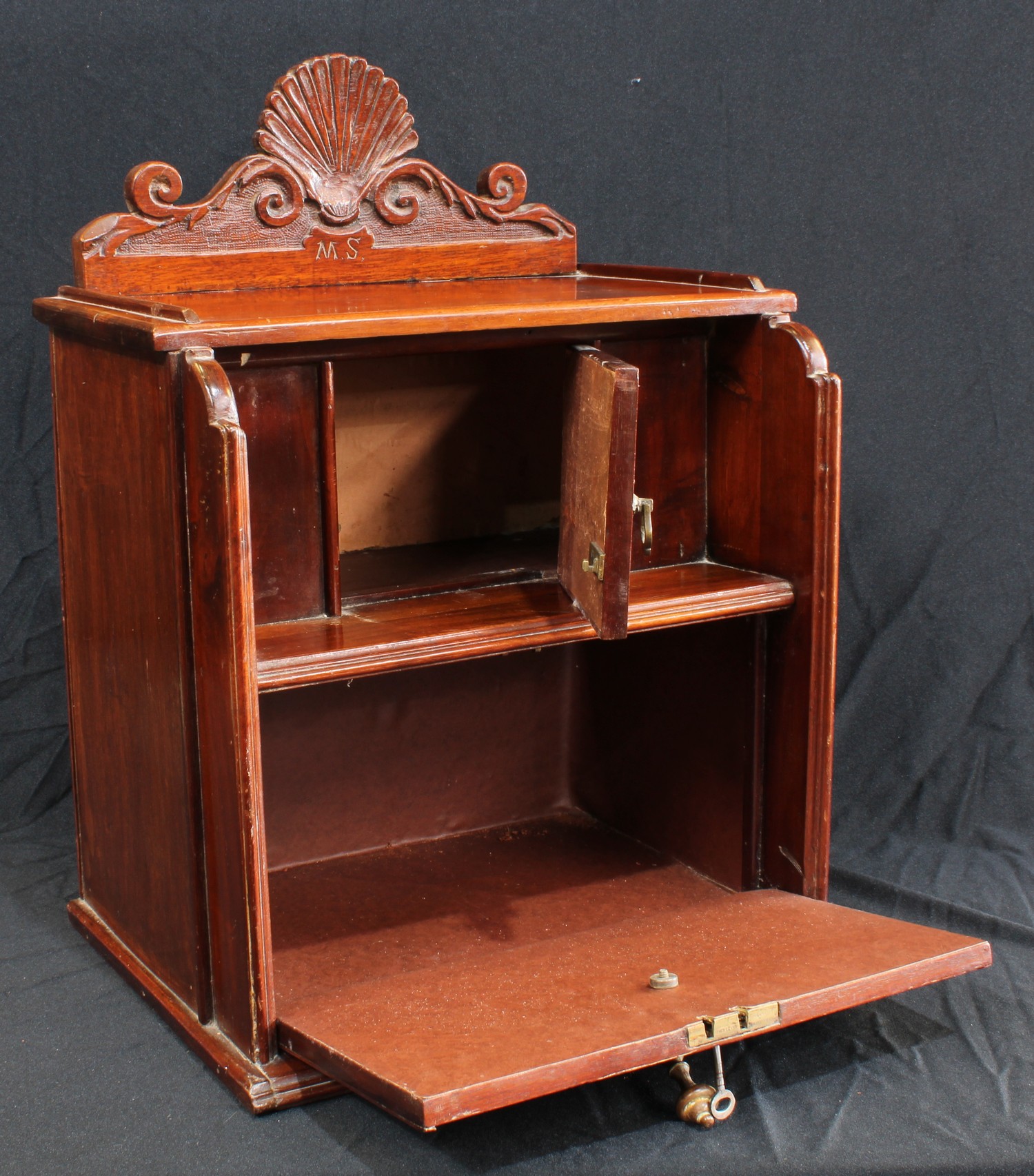 An early 20th century mahogany desk top cabinet, shaped cresting above an open niche and fall front, - Image 2 of 3