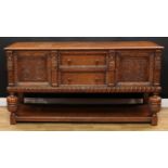 A 17th century style oak sideboard, of Jacobean inspiration, rectangular top above a pair of short