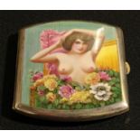 A Continental enamel erotic cigarette case, hinged cover decorated in polychrome with a risque