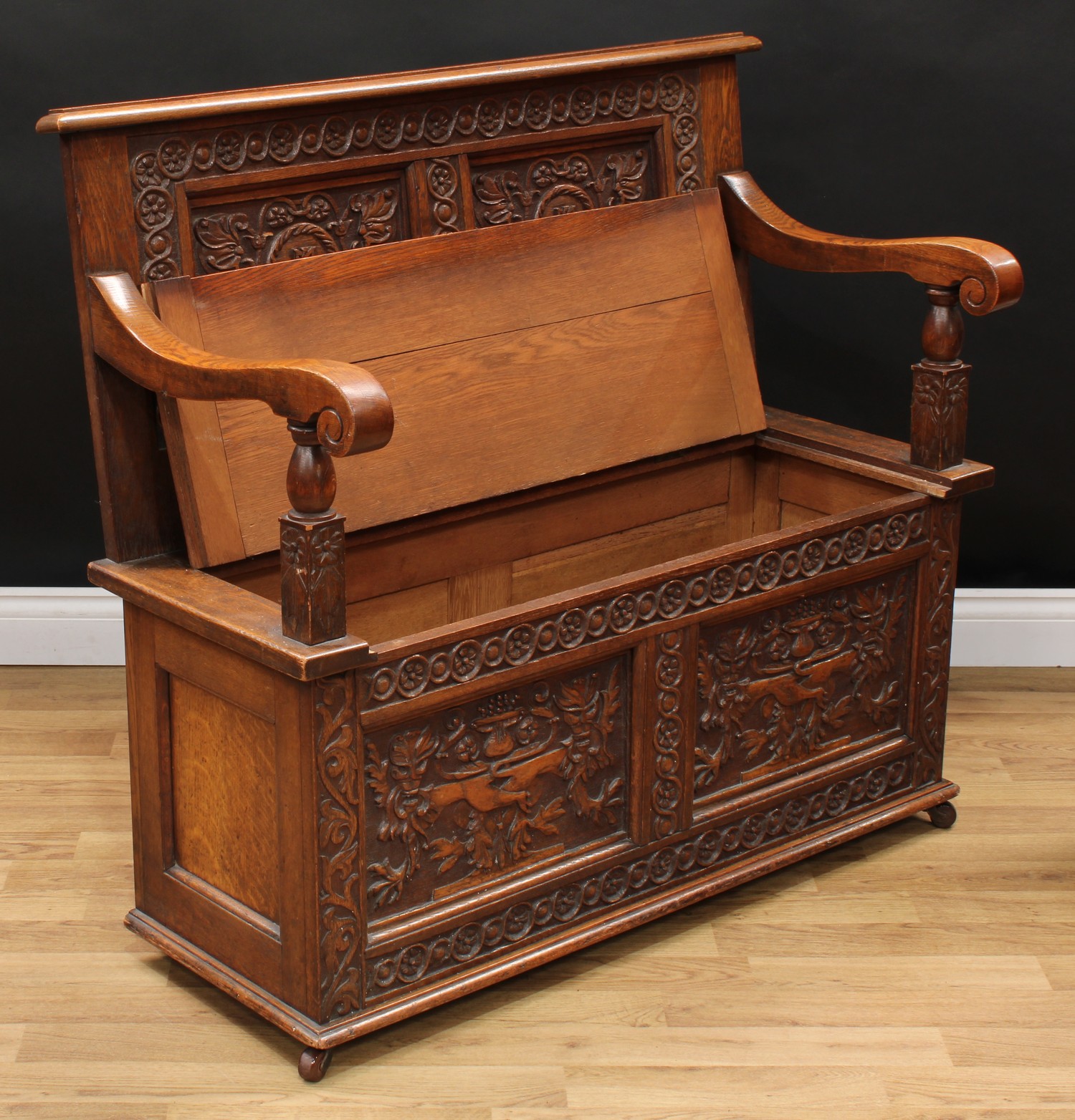 A 17th century style oak box settle or bench, two panel rectangular back initialled MA and carved - Image 3 of 3