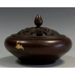 A contemporary Chinese bronze coloured metal cencer, gold coloured splashed circular base, cast