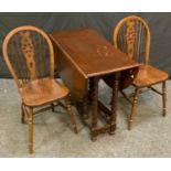 An oak barley twist drop-leaf table; a pair of wheelback chairs (3)