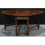 A 17th century style oak gateleg drop leaf dining table, oval top with fall leaves, drawer to