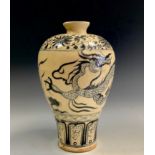 A contemporary Chinese blue and white pottery vase, decorated with a cloud dragon, 24cm high.