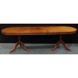 A Regency reproduction twin pedestal extending dining table