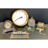 An early 20th century ebony cased desk timepiece, silvered dial, Arabic numerals, stepped case; a