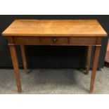 An oak side table, spinning rectangular top above a faux freeze drawer, tapered square legs, 73cm