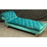 A Victorian chaise longue, button back upholstery, scroll arm, turned feet, 184cm long, 65cm wide.