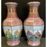 A pair of contemporary Chinese octagonal vases, each side decorated with a figural panel, multi