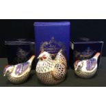 A Royal Crown Derby Chicken paperweight; a pair of similar Goldcrests, all gold stopper, boxed (3)