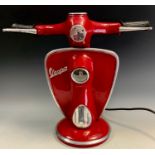 A Novelty table lamp, as a Vespa Scooter front, 32cm high