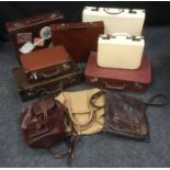 Vintage luggage - a leatherette overnight suitcase with matching vanity case; a leather briefcase;