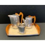 Metalware - a Picquot ware three piece tea set on tray; Victorian copper kettle; pair of Cobra brass