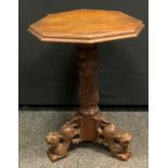 A late 19th century carved oak octagonal occasional table, stepped top, carved column and