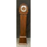 A 1940s oak granddaughter clock, eight day movement, 137cm high.