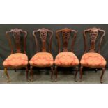 A set of four late Victorian/Edwardian mahogany dining chairs, Chinese Chippendale inspired, stuffed