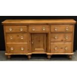 A 19th century farmhouse country kitchen sideboard, rounded rectangular top above a central drawer