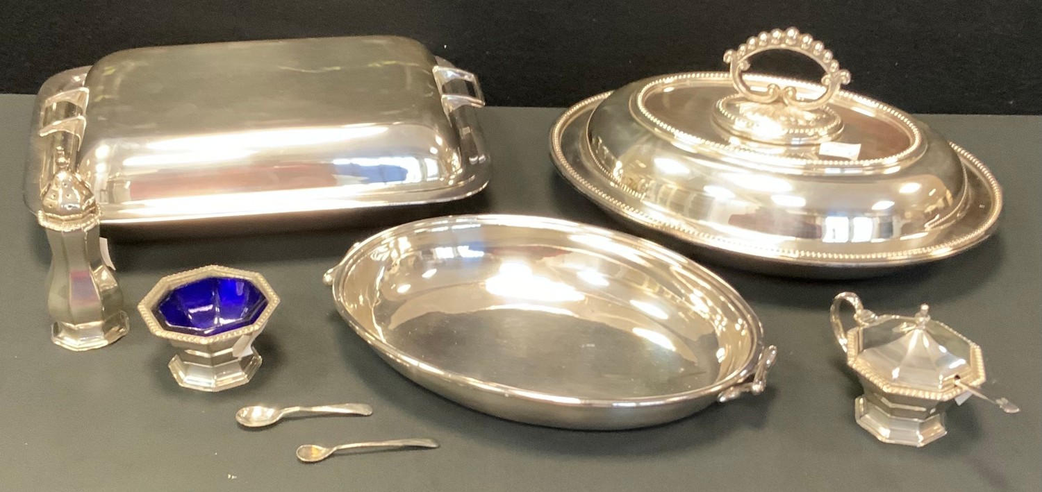 An EPNS oval entree dish and cover, bayonet loop handle; another, rectangular; a three piece