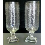 A pair of contemporary cut glass storm shades, stepped square bases, 40cm high