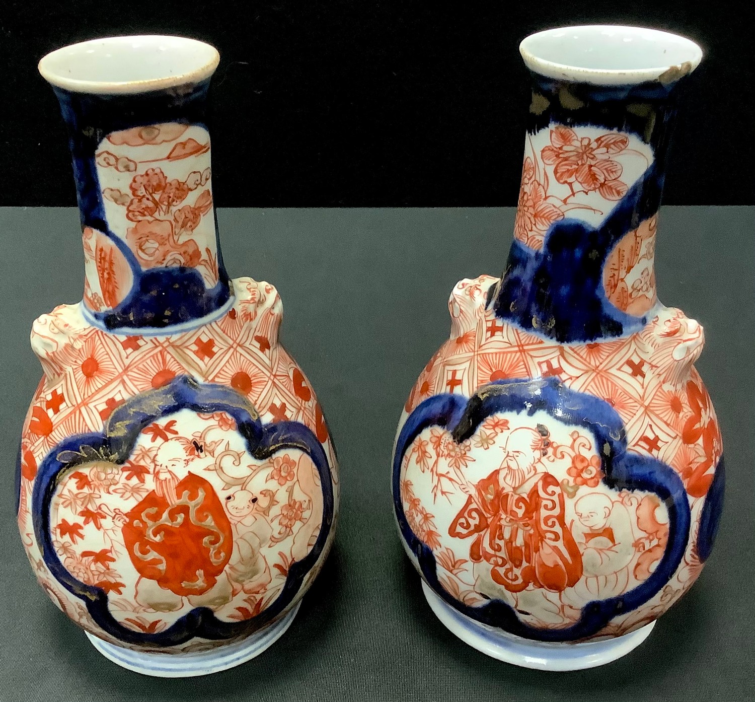 A pair of late 19th century Japanese Imari bottle vases, 18.5cm high