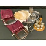 A pair of E.P.N.S rounded rectangular entree dishes and covers; knife rests; toast rack; linen and