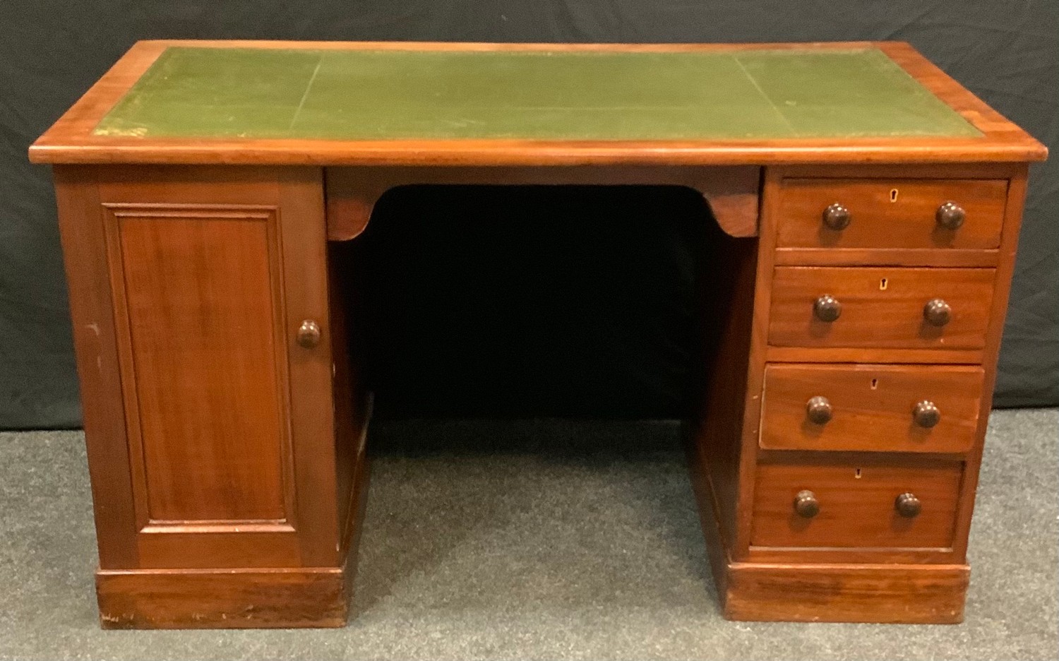 A late Victorian mahogany twin pedestal desk, rectangular top with inset writing surface,
