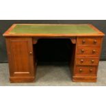 A late Victorian mahogany twin pedestal desk, rectangular top with inset writing surface,
