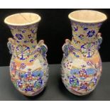 A pair of Japanese Satsuma pottery twin handled vase, decorated with Samurai Warriors and Elders,