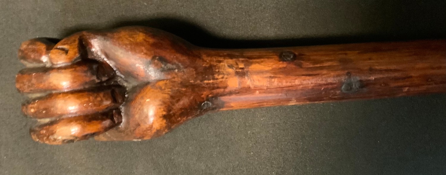 A Boer war period prisoner of war walking stick, carved as a clenched fist, inscribed 1912, Bermuda, - Image 2 of 2