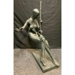 Contemporary School, a floor standing bronze, of a naked lady seated, with stress holes and