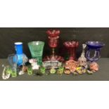 A Victorian cranberry glass epergne, malachite glass cornucopia vase; paperweights, glass animals