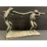 Contemporary School, a green patinated anthropomorphism bronze, of two frogs, carrying a stick, 55cm