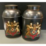 A pair of contemporary black shop tea canisters, printed in polychrome with Royal Coat of Arms, 46cm