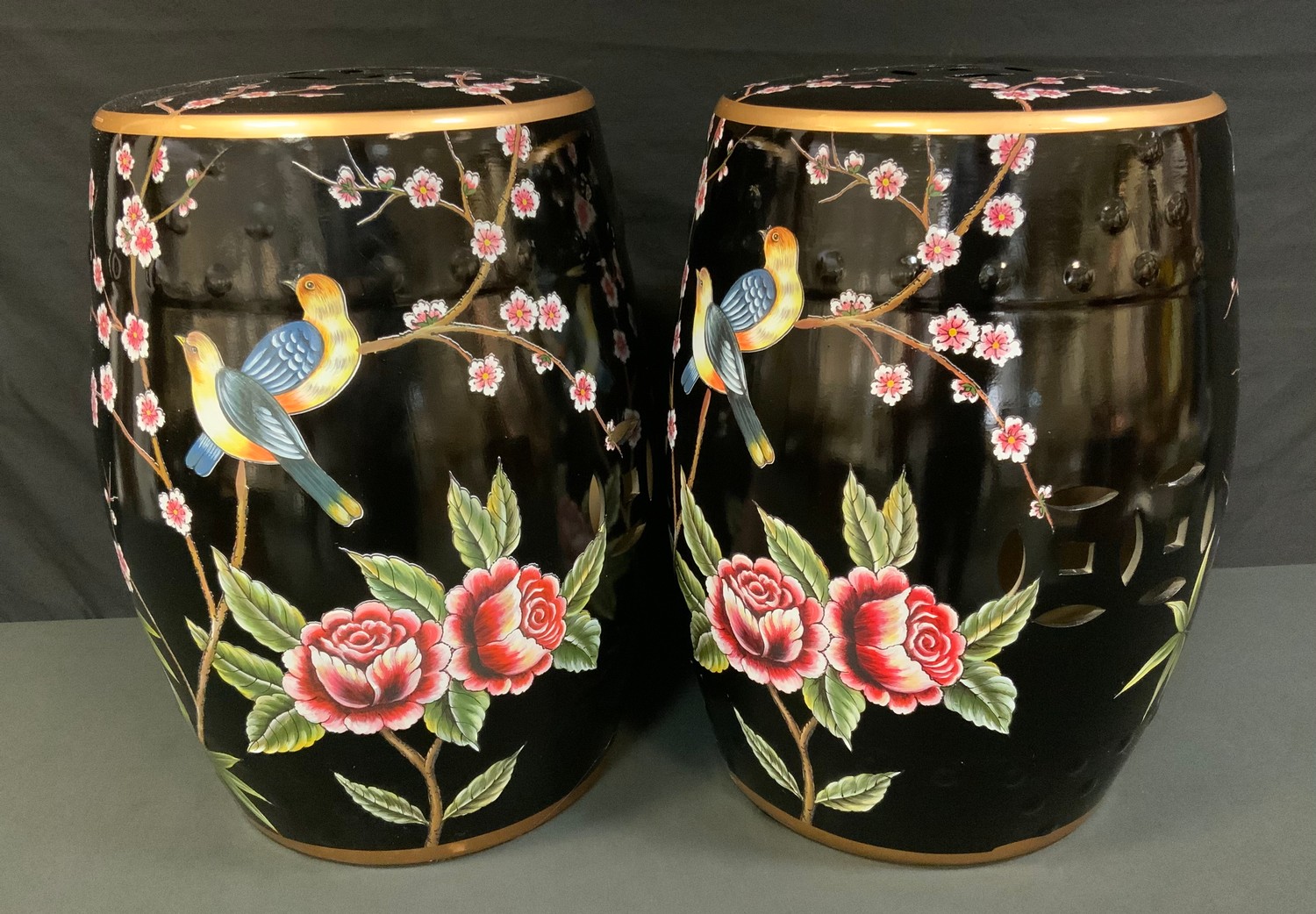 A pair of contemporary Chinese conservatory barrel seats, decorated with fanciful birds and prunus