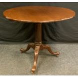 A 'George III' oak tripod occasional table, circular tilting top, cylindrical column, cabriole legs,