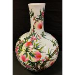 A large modern Chinese bottle vase, decorated in polychrome with peaches and foliage, 55cm high