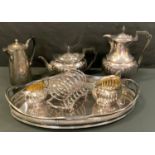 A early 20th century silver plated four piece tea service, gadrooned body, ebony handles, Atkin