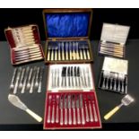 A set of six EPNS fish knives and forks, oak case; a set of fish servers; cake forks; butter knives;