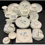 A Wedgwood Ice Rose pattern dinner and tea service inc dinner, side plates, oval plates, bowls,