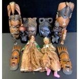 An African wall mask; others, ebony busts; a pair of Ottoman Turkish painted wooden dolls etc