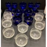 A set of six Bristol blue glass wine glasses, another larger; eight glass clear cut glass rinsing